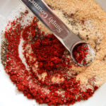 Mixing spices together.
