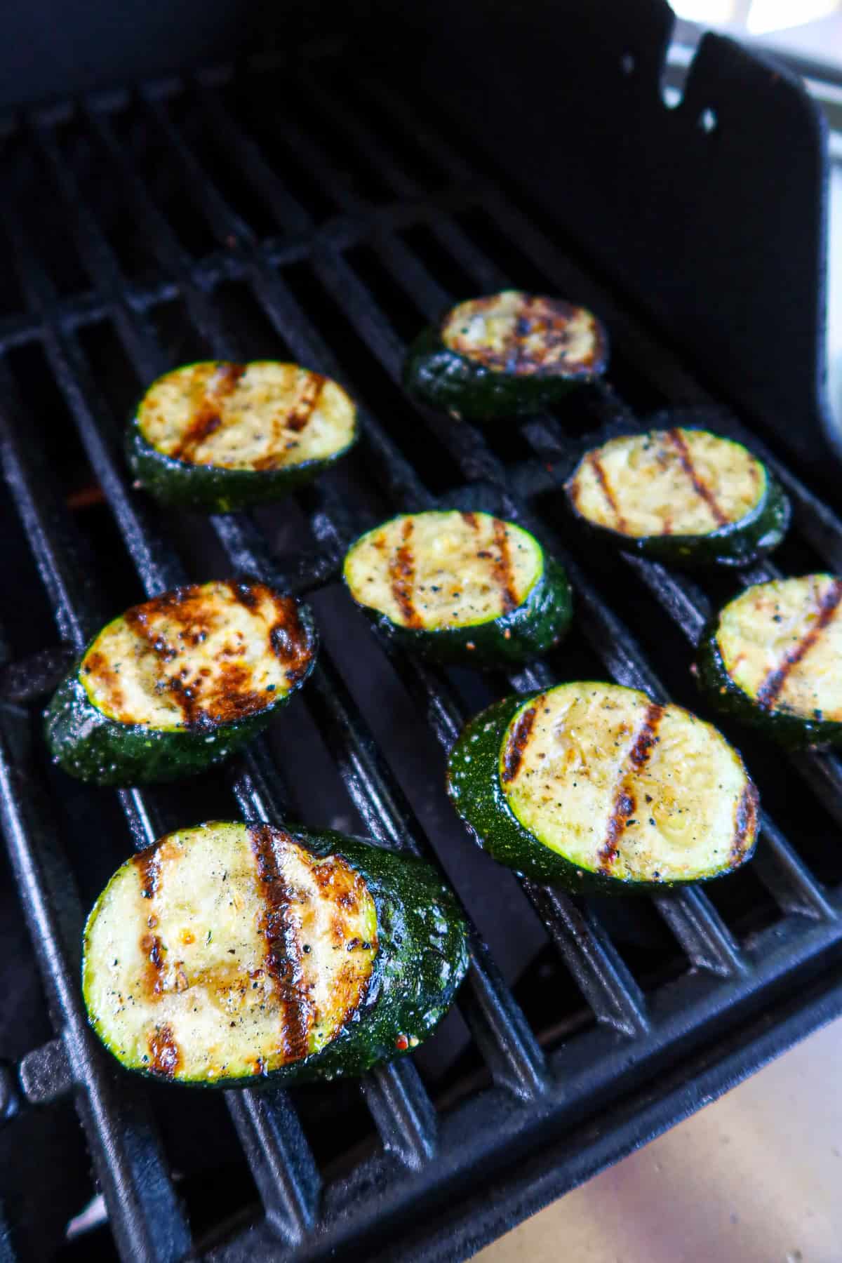 Zucchini cooking on the grill.