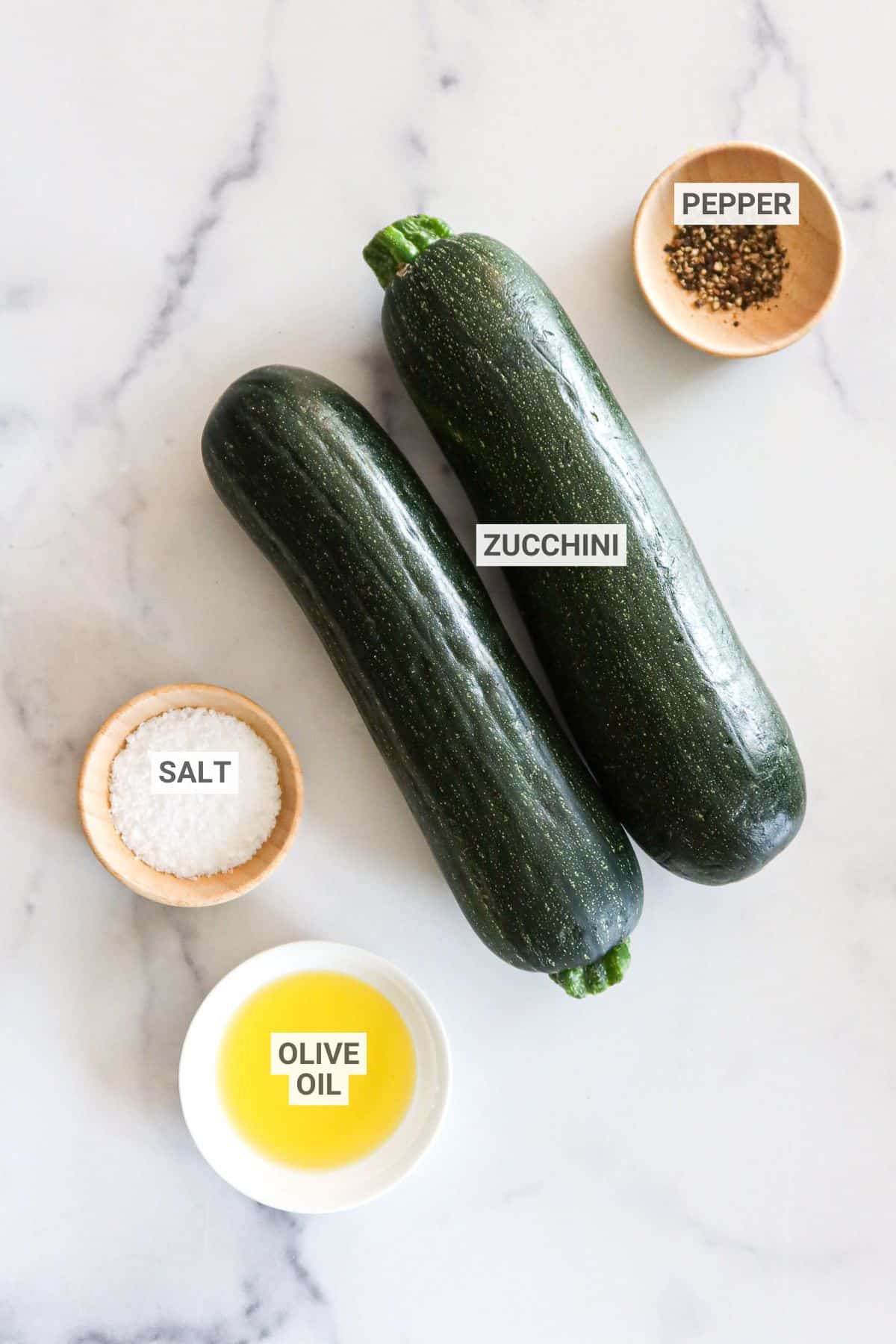 Ingredients for grilled zucchini with text overlay labels.
