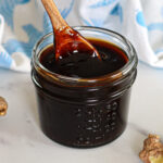 Homemade teriyaki sauce in a glass jar.