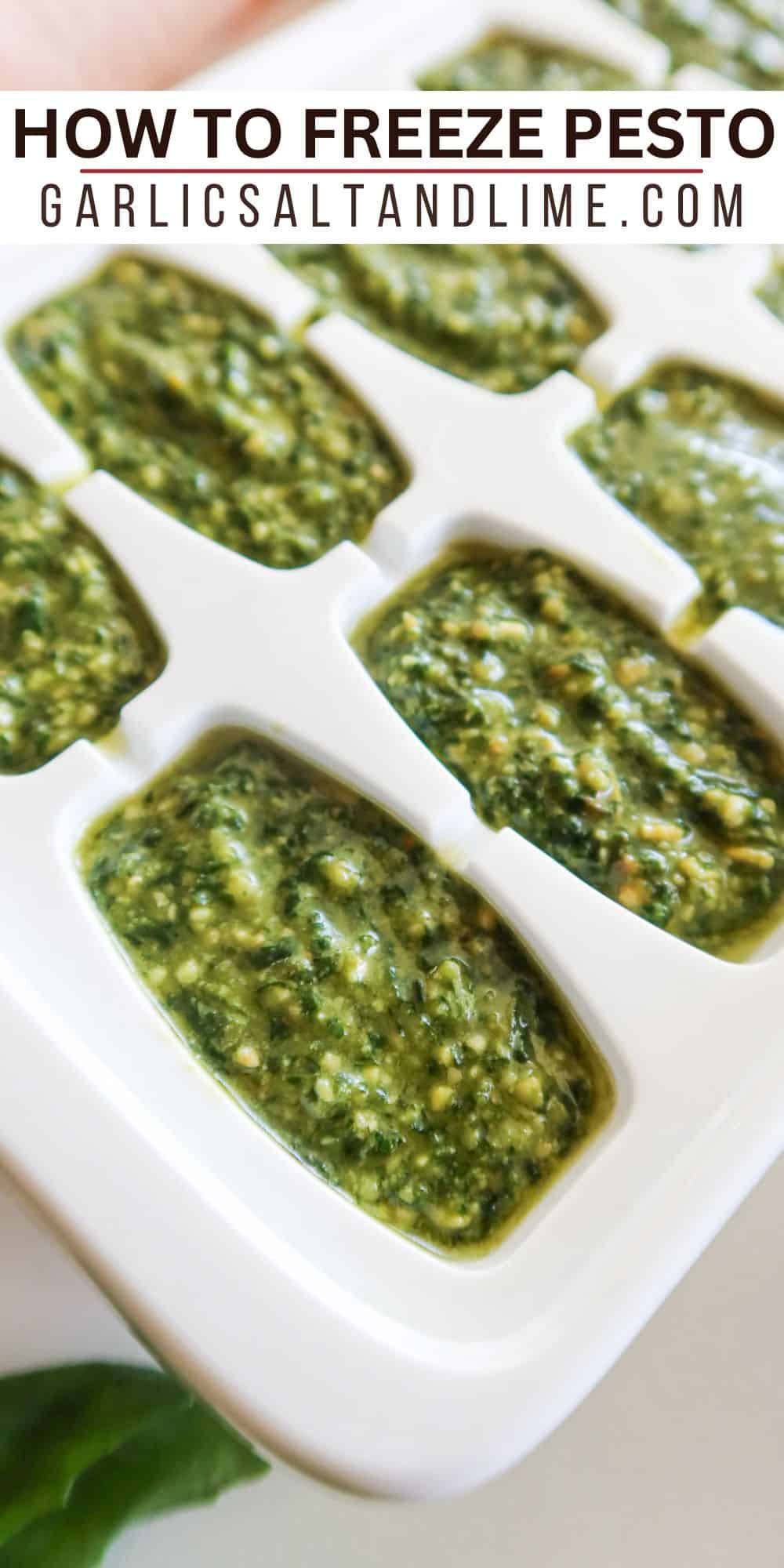 Pesto portioned into an ice cube tray for freezing.