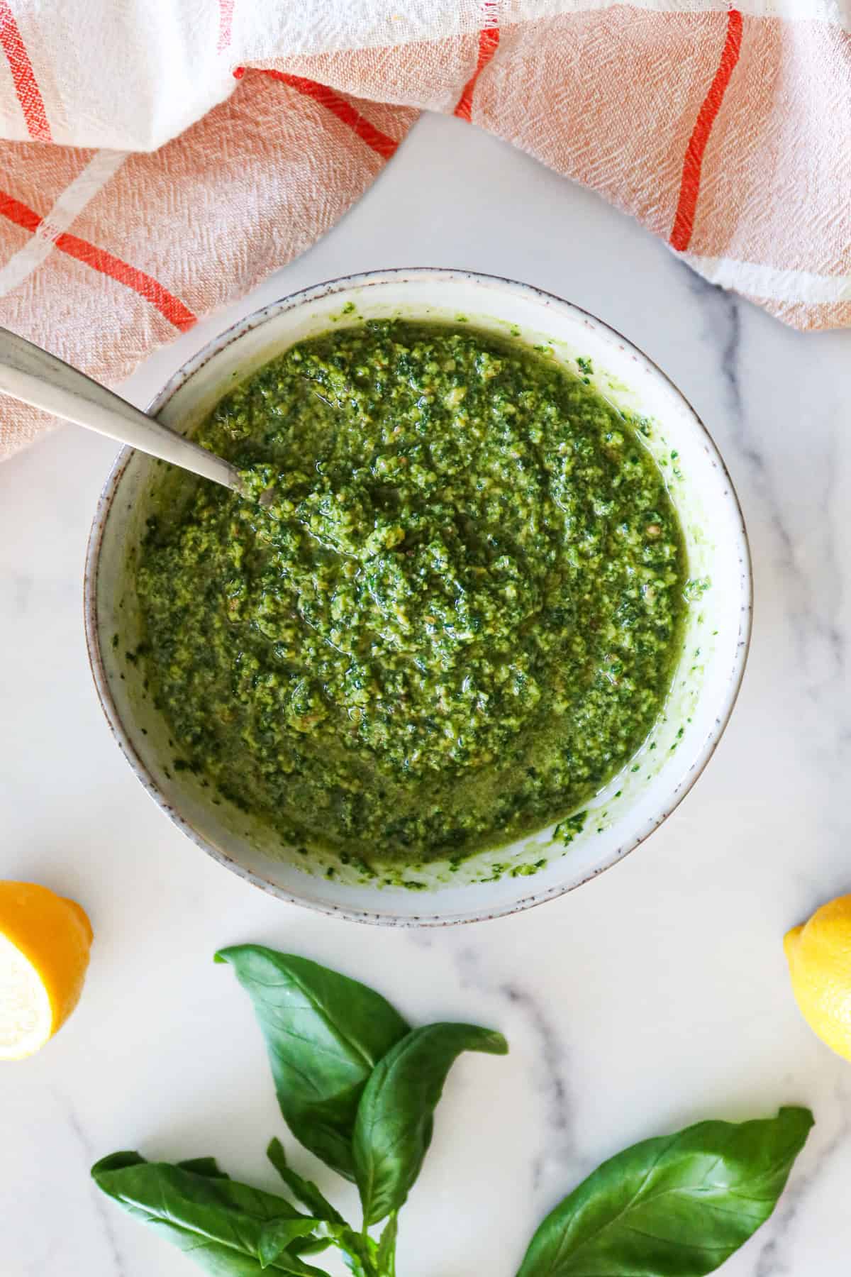 A bowl of homemade basil pesto.