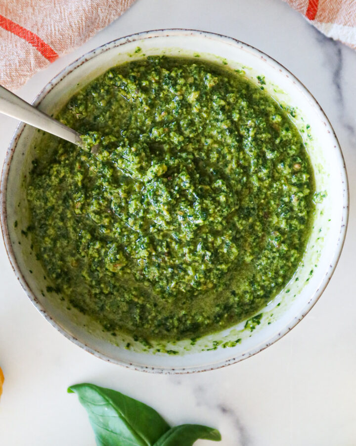 A bowl full of homemade pesto.