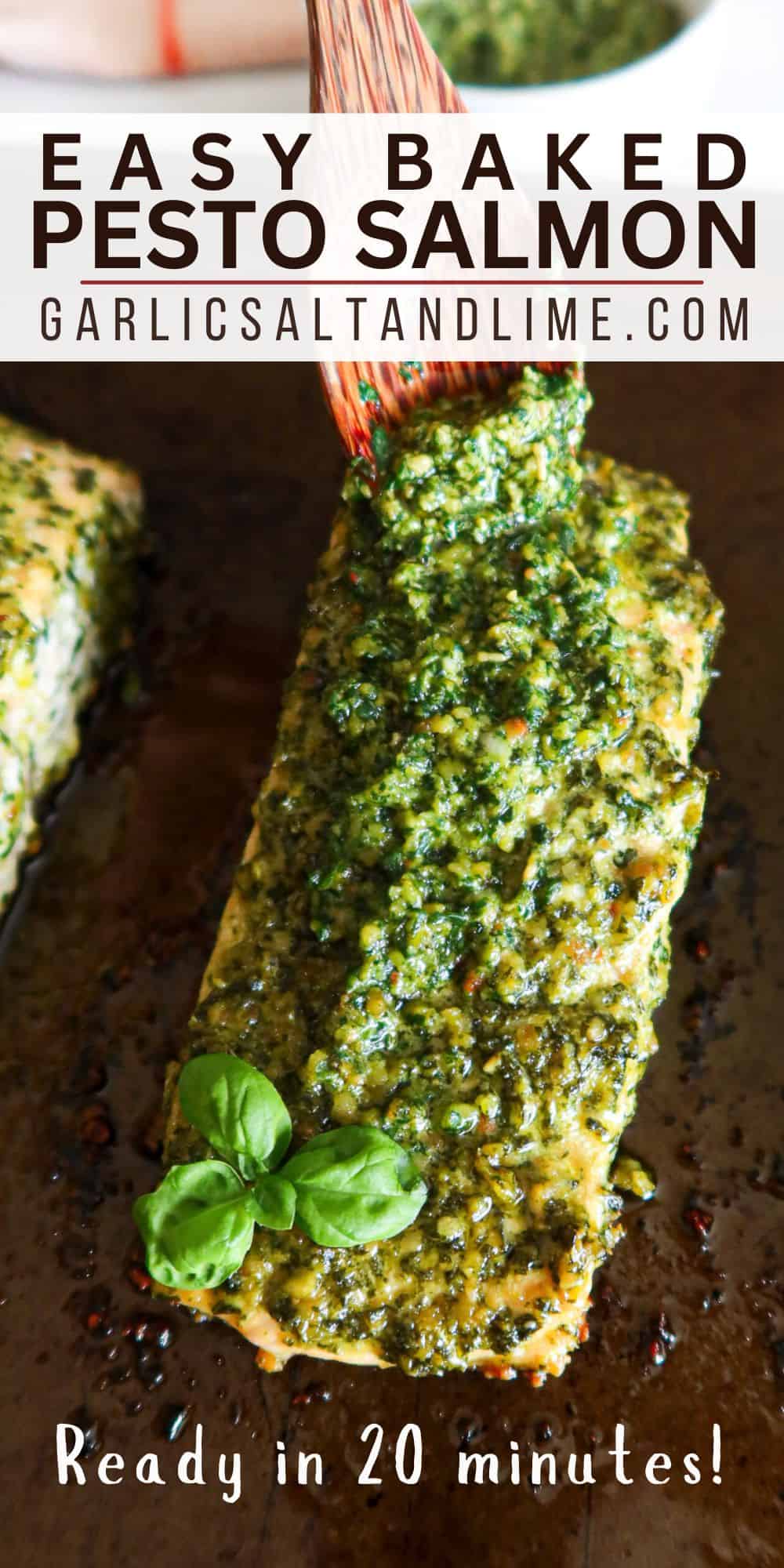 Pesto salmon on a baking sheet with text overlay for Pinterest.