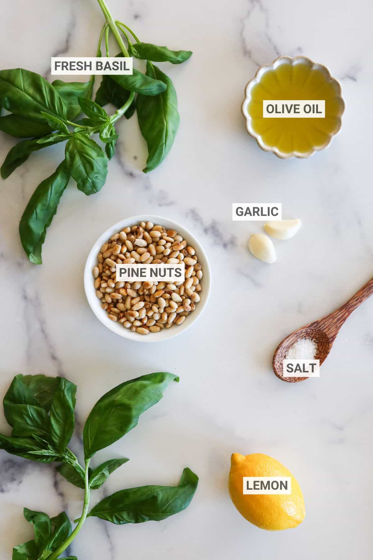 Dairy free pesto ingredients with labels.